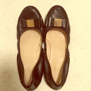 Cole Haan “Tali” black and gold bow flats